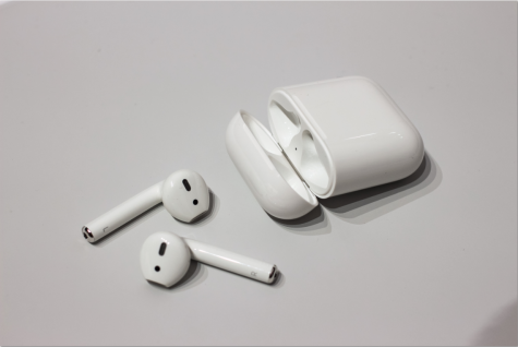 The Apple AirPods and the charger/case that it comes in.
