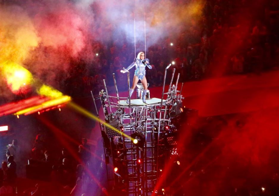 Courtesy of Brian Allen. Lady Gaga skillfully lands on the Super Bowl halftime stage hanging from only a couple ropes