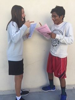 Victoria Milev (9) and Kartik S. Chowtkur (9) poses to represent debate. 