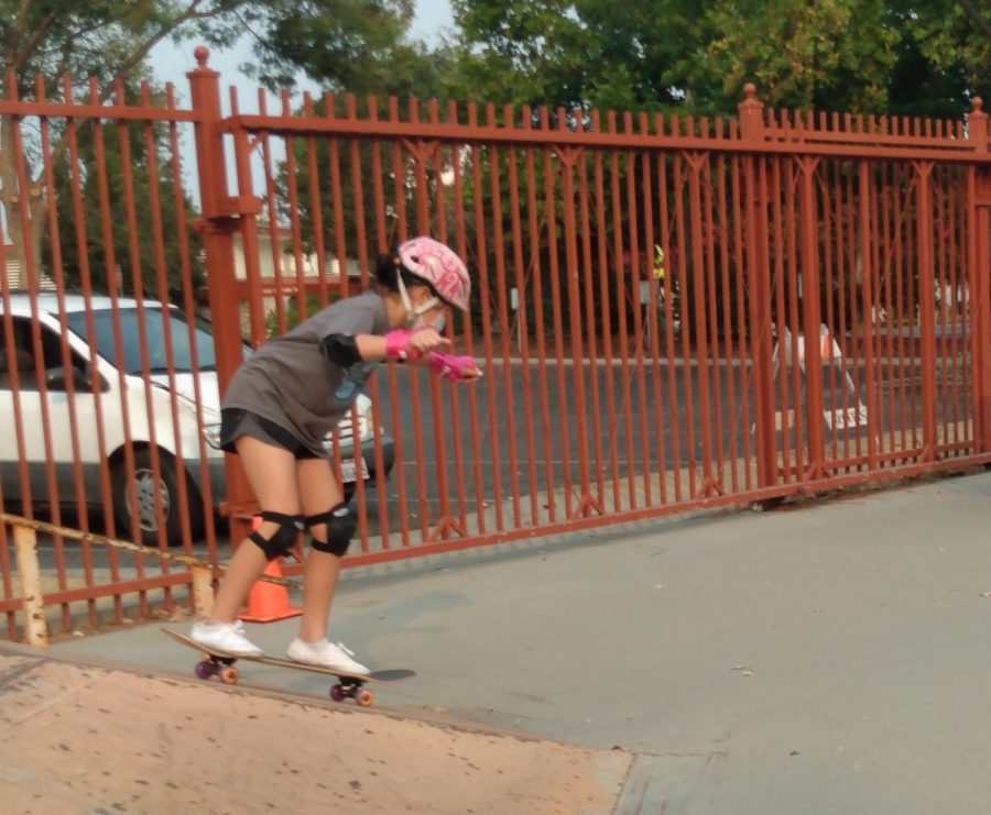 Young skater at the Campbell Community Center Skate Park going down a ramp. Courtesy of Keira Zehna.