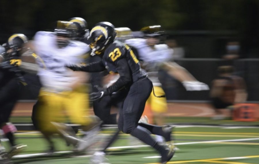 Fresh out of the locker room, Luther Glenn (23) kicks off half-time dominating the field. Courtesy of Edgar Navarro.