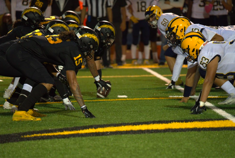 Kiana Guanga - The Wilcox offensive line prepares for a head-to-head clash against Milpitas. Courtesy of Wilcox Photo Video Club.