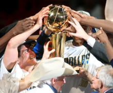 The 2011 Champion Dallas Mavericks pose with their first Larry O'Brien Trophy. 