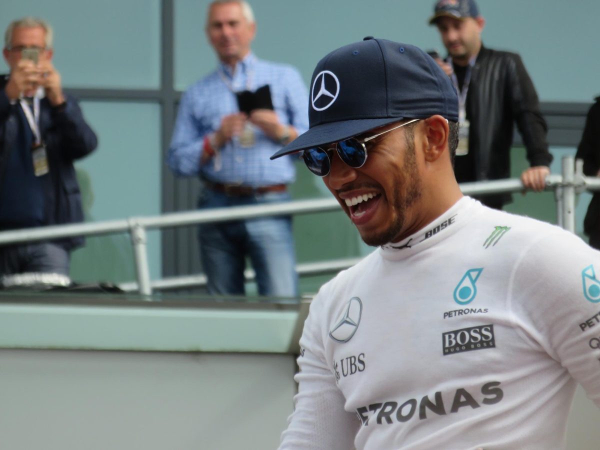 Lewis Hamilton celebrating with fans after his victory at the British GP at Silverstone. 