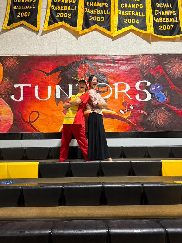 Tommer Kerem and Maggie Wu posing with the junior banner after skit night. Courtesy of Maggie Wu.