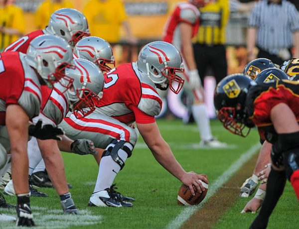 An intense stare down on the football field before the whistle is blown.