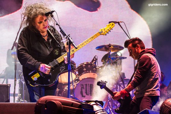 Robert Smith and Simon Gallup of The Cure playing a live show in 2013. 