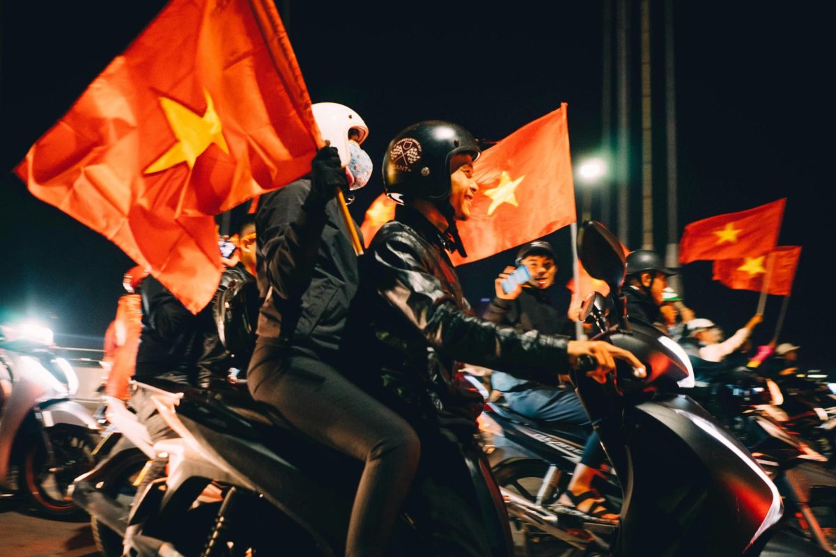 Vietnamese people out late celebrating in the streets.