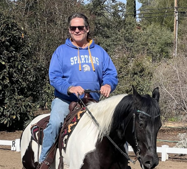 Mr Rabe riding a horse.