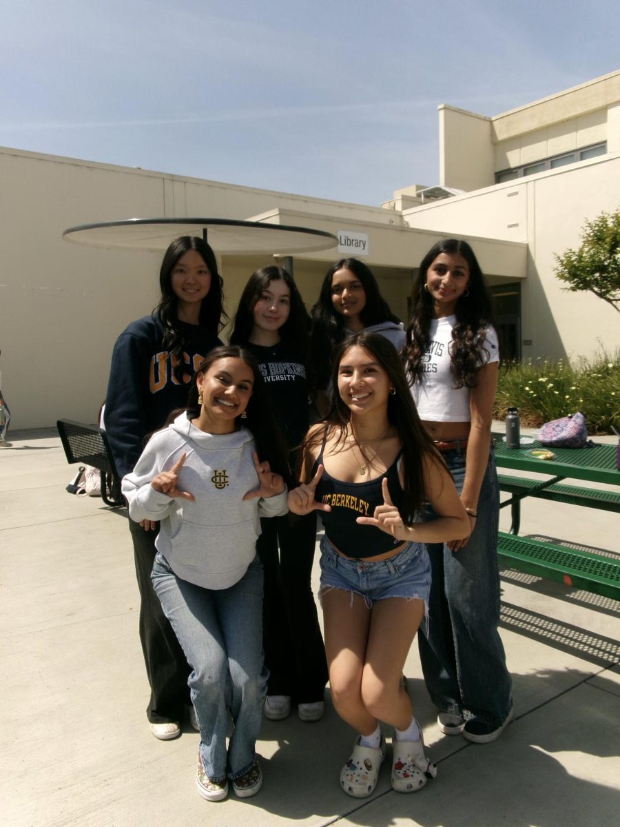 A group of Wilcox seniors wearing their college merch on commitment day.