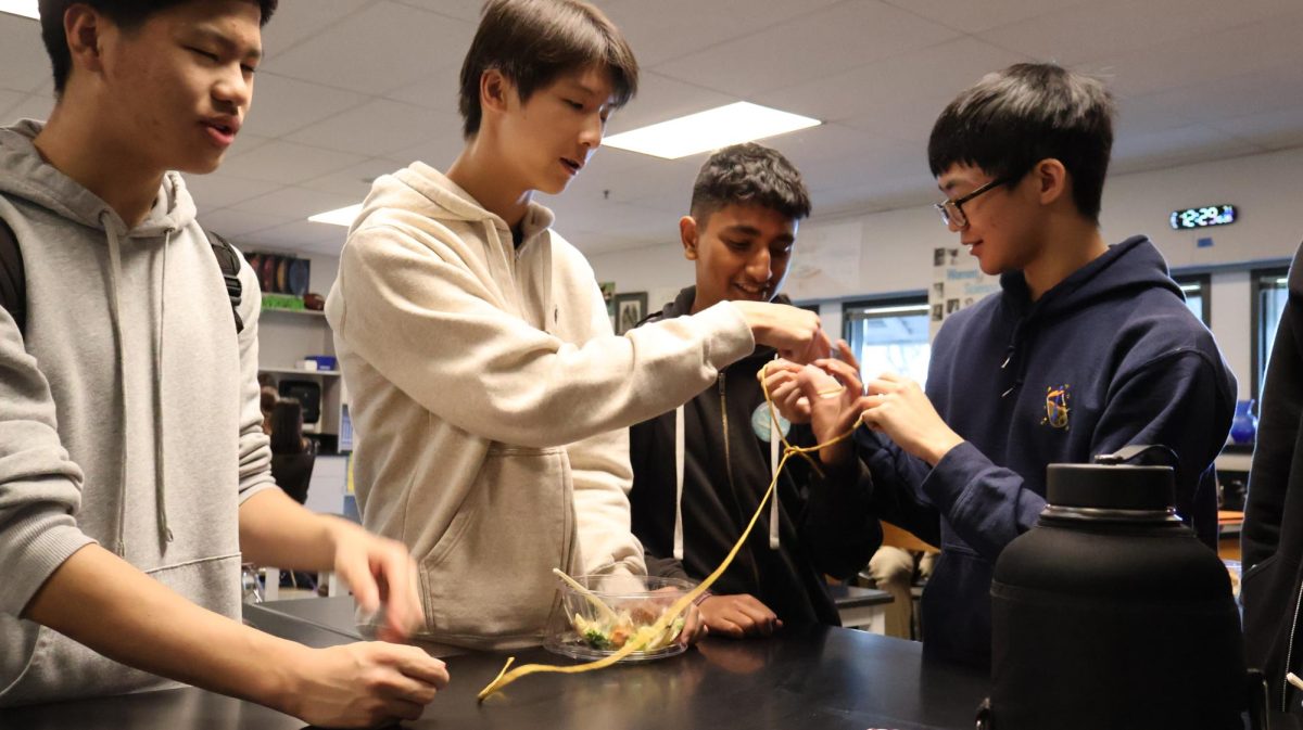 Students at the Survival Club practice tying knots.